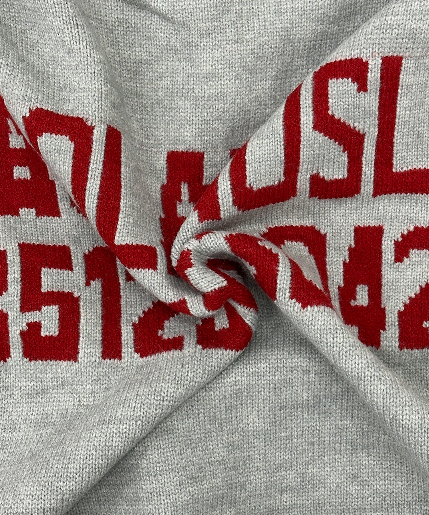 バックロゴハーフジップニット